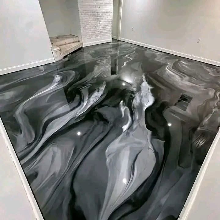 Dark patterned floor beneath bathroom fixtures