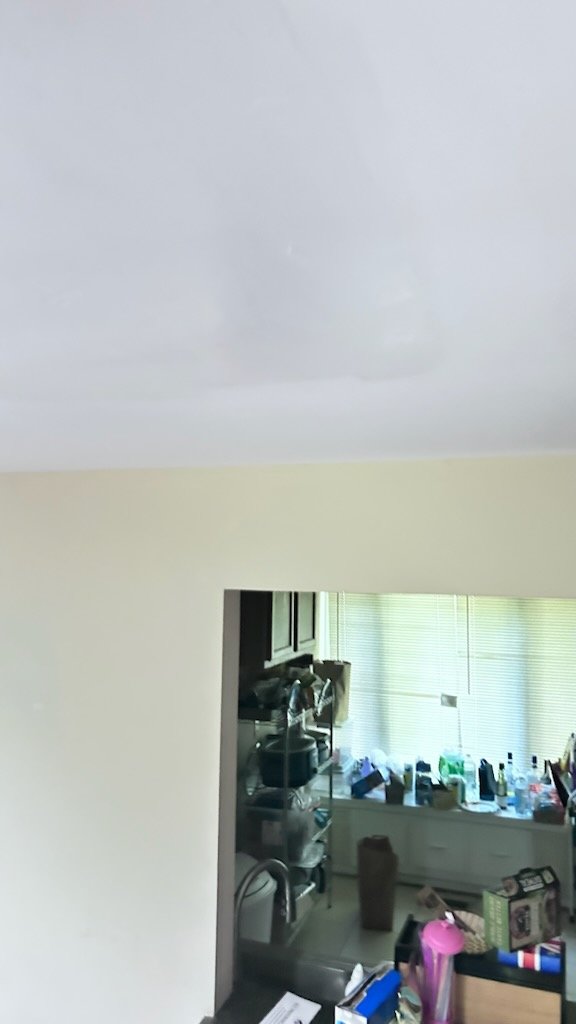 Ceiling surface above a furnished room